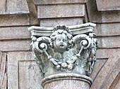 Corinthian capital with an angel who wolds a festoon with his wings, in Stiftskirche Mariae Himmelfahrt in Schlägl (Austria)