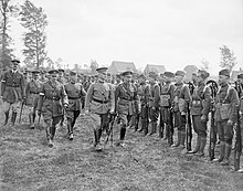 British King George V and Major General John F. O'Ryan (center), commanding the 27th Division, inspecting doughboys of Company L, 108th Infantry, 27th Division, August 6, 1918. The US Army on the Western Front, 1917-1918 Q9257.jpg