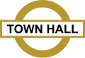 A recreation of a gold roundel sign that can be found in Town Hall train station in Sydney