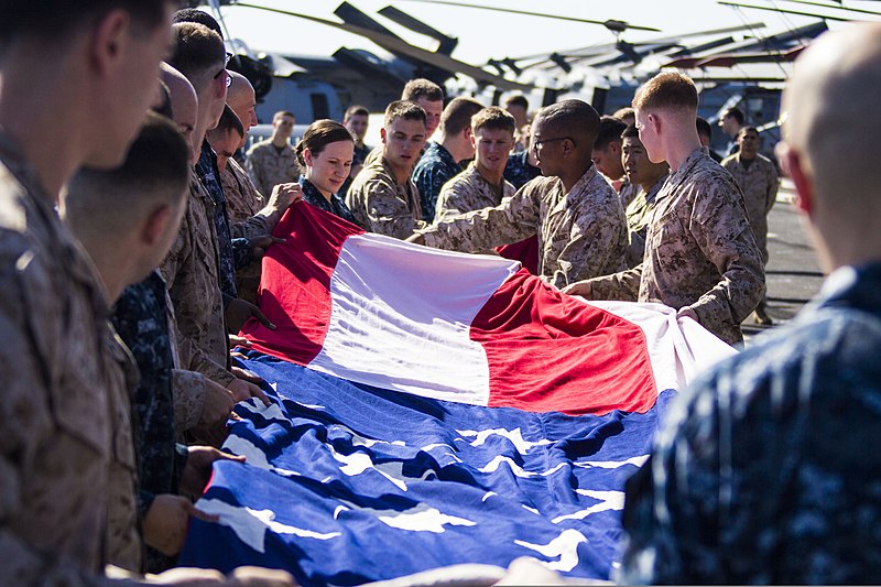 File:U.S. Marines and Sailors assigned to the 26th Marine Expeditionary Unit (MEU), and Sailors assigned to the USS Kearsarge (LHD 3), fold the American flag to commemorate the Fourth of July during their 2013 130704-M-BS001-009.jpg