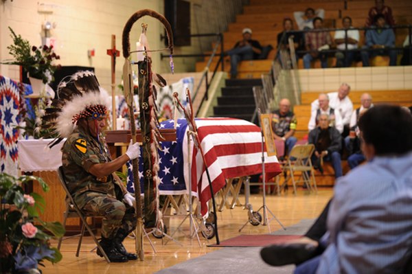 Remains of a native American soldier, who died during the Korean War, are honored at a funeral in Eagle Butte before reburial in South Dakota in 2009.