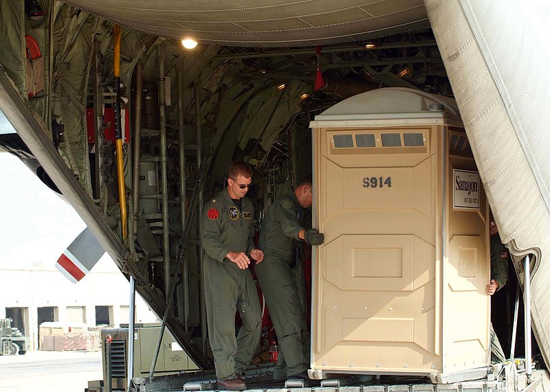 File:US Navy 050903-N-6046R-013 U.S. Navy personnel, assigned to Fleet Logistic Support Squadron Five Five (VR-55), load their C-130 Hercules aircraft with portable restrooms and other supplies.jpg