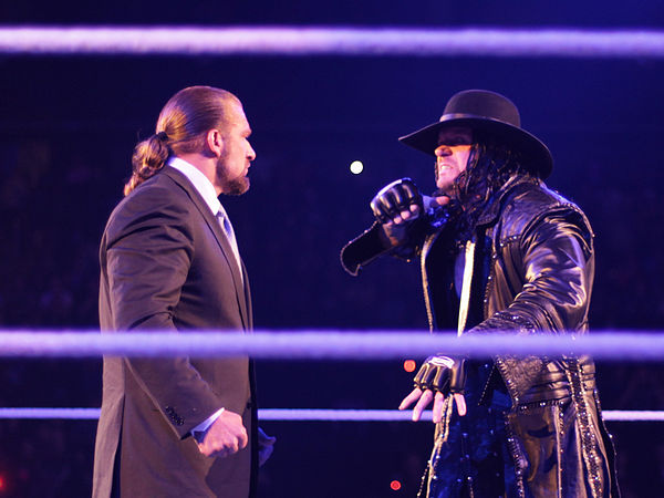 Chief Operating Officer Triple H being taunted by The Undertaker ahead of their second consecutive WrestleMania match