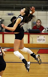 A girls volleyball player at Bellaire High School Volleyball player jumping.jpg