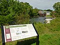 Wamesit Falls Overlook, located at the southern end of the Concord River Greenway near 1000 Lawrence Street, Lowell, Massachusetts. The plaque in the foreground gives historical information about the surrounding area.