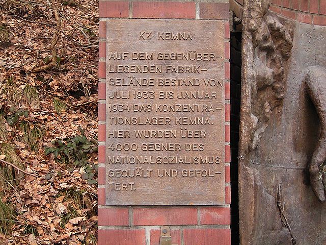 Plaque on left side of monument