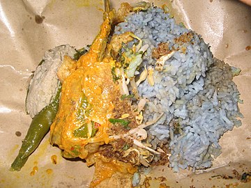 Fast-food portion of nasi kerabu in paper