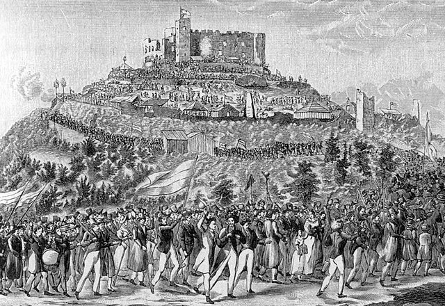 Pro-nationalist participants march to the ruins of Hambach Castle in 1832. Students and some professionals, and their spouses, predominated. They carr