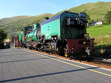 138 'Mileniwm'/'Millennium' SAR NGG 16 Class Garratt arrives at Snowdon Ranger station with a southbound service from Caernarfon to Rhyd Ddu 138atSnowdonRanger.jpg