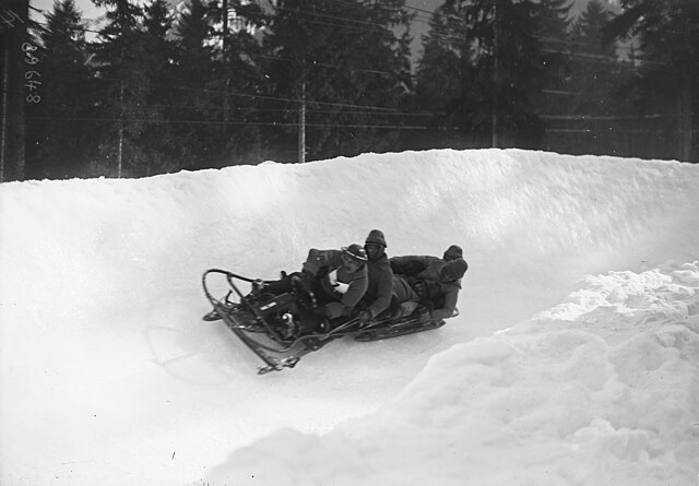 Photograph of the Italian team competing on a bobsleigh