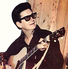 Orbison began performing while wearing sunglasses in 1963, later recalling that he wasn't trying to be weird ...  I didn't have a manager who told me to dress or how to present myself or anything, but the image developed of a man of mystery and a quiet man in black somewhat of a recluse, although I never was, really.[49]