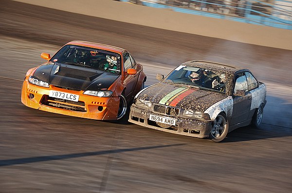 A Nissan Silvia S15 and a BMW E36 tandem drifting