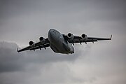 A Boeing C-17 Globemaster III, tail number 95-0103, taking off from RAF Mildenhall in the United Kingdom. It is assigned to the 62nd Airlift Wing and the 446th Airlift Wing at Joint Base Lewis McChord in Washington, USA.