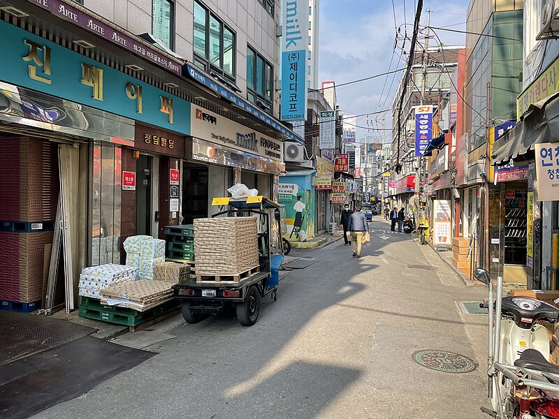 File:A paper wholesaler in Euljiro printing alley, paper delivery packed in front of the shop.jpg