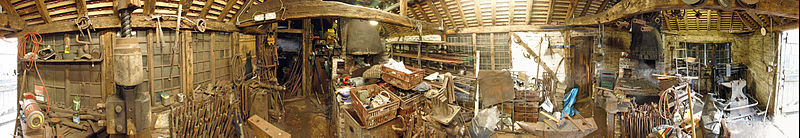 The two hearths in Chiddingfold forge seen in 2014. The main entrance from NW seen at each end of the image A view of the interior of the working Chiddingfold forge..jpg