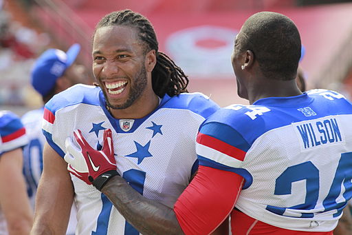 Arizona Cardinals wide receiver Larry Fitzgerald, left, and defensive safety Adrian Wilson share a laugh during the National Football League's 2012 Pro Bowl game at Aloha Stadium in Honolulu Jan. 29, 2012 120129-M-DX861-053