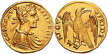 Një monedhë ari, e cila përshkruan bustin e një burri dhe një shqiponje