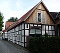 elongated three-column half-timbered house