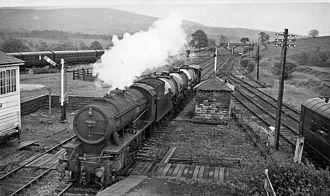 Bolton Abbey Station with a Down train of tank wagons in 1961 Bolton Abbey railway station geograph-2146164.jpg