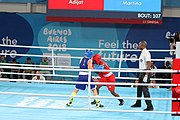 Deutsch: Boxen bei den Olympischen Jugendspielen 2018 Tag 12, 18. Oktober 2018 - Finale Fliegengewicht Mädchen – Martina La Piana (Italien, blau) schlägt Adijat Gbadamosi (Nigeria, rot) 5-0; Ringrichter ist James Beckles (Trinidad und Tobago). English: Boxing at the 2018 Summer Youth Olympics on 18 October 2018 – Girl's flyweight Gold Medal Bout - Martina La Piana (Italy, blue) beats Adijat Gbadamosi (Nigeria, red) 5-0; Referee is James Beckles (Trinidad and Tobago). Español: Boxeo en los Juegos Olímpicos Juveniles de Verano de 2018 en 18 de octubre de 2018 - Combate a medalla de oro de peso mosca para mujeres: Martina La Piana (Italia, azul) le gana a Adijat Gbadamosi (Nigeria, roja) 5-0; El árbitro es James Beckles (Trinidad y Tobago).