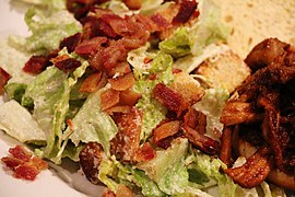 Caesar Salad, Up Close, Pulled Pork in Background.jpg