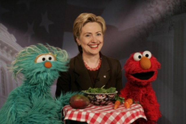 Elmo and Rosita film a PSA in 2005 with then-Senator Hillary Clinton