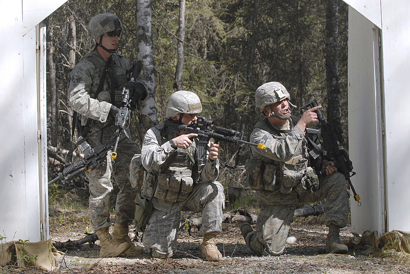 File:Defense.gov News Photo 110524-F-LY131-952 - Senior Airman Payton Barnes left Airman 1st Class Stephen Becker and Staff Sgt. John Szewzyk right come under simulated fire during a village.jpg