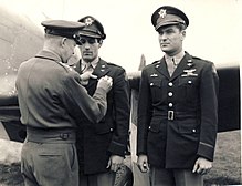 General Dwight D. Eisenhower awards the Distinguished Service Cross to Gentile (left) and Colonel Donald Blakeslee on 11 April 1944.