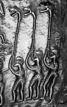 Three carnyx players depicted on plate E of the Gundestrup cauldron Figures with horns on the Gundestrup Cauldron.jpg