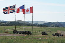 Flags of the United Kingdom, United States, and Canada waving near the entrance to the South Dakota Army National Guard's Golden Coyote training site in Custer State Park in East Custer. Flags from the United Kingdom, United States and Canada wave near the entrance to the South Dakota Army National Guard's Golden Coyote training site in Custer State Park in East Custer, S.D., June 17, 2012 120617-A-IM587-374.jpg
