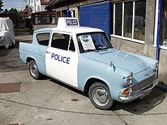 A Ford Anglia "panda car" of the 1960s
