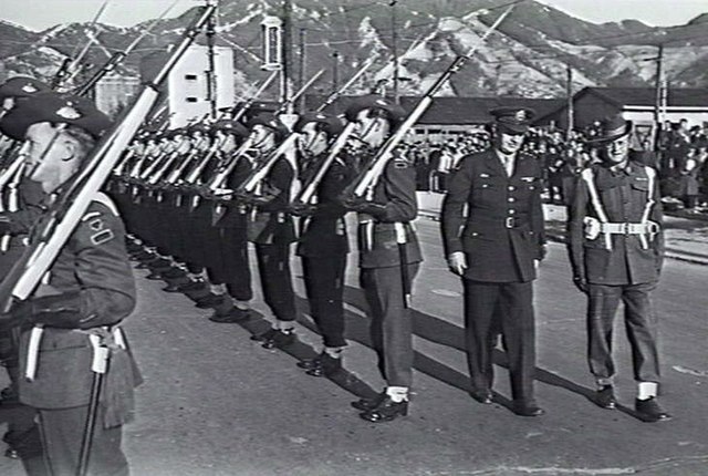 General Robert L. Eichelberger inspects the Australian Guard of Honor at Kure.