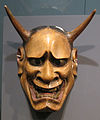 Japanese wooden mask depicting demon.