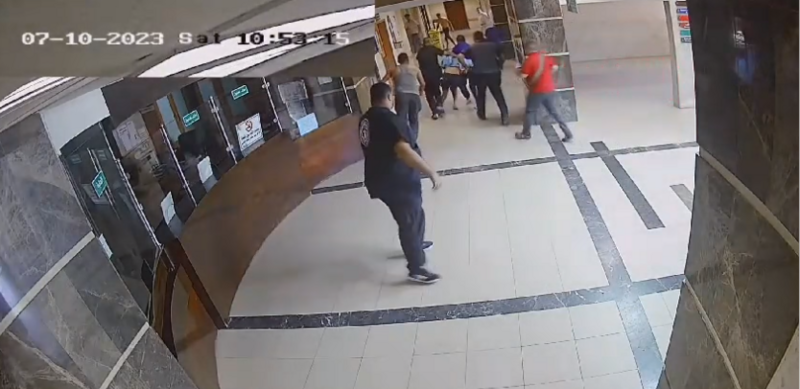 File:Hostage being dragged through foyer of Al Shifa Hospital by Hamas gunmen.png