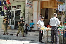 IDF soldiers patrol in Hebron Israeli soldiers on Palestine street.jpg