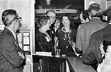 Jacqueline Kennedy Onassis (center) on board the Landmark Express, a special charter train by the Committee To Save Grand Central Terminal, on April 16, 1978. The group chartered the train to Washington D.C. for the day before oral arguments in the case. Jackie Kennedy on Landmark Express, April 1978.jpg