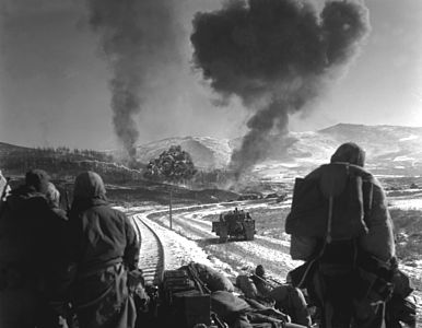 United States marines watch on as F4U Corsairs provide close air support during the Battle of Chosin Reservoir, North Korea, December 1950.