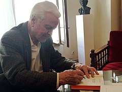 a man signing a book