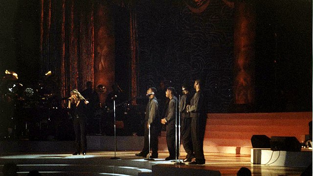 Carey performing "One Sweet Day" with Boyz II Men at Madison Square Garden in October 1995
