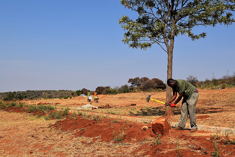 File:Men breaking rocks.jpg