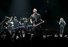 Metallica performing in London in 2017 Metallica - The O2 - Tuesday 24th October 2017 MetallicaO2241017-3 (37955387006) (cropped).jpg