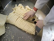 Curds are milled by hand Milling.jpg