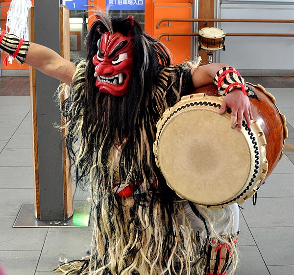 A dancing drummer wearing a Namahage costume, performed Namahage-Daiko in Akita Station.