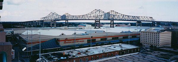 The New Orleans Morial Convention Center in front of the Crescent City Connection in 2001