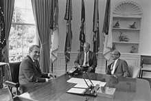 Friedman with Richard Nixon and George Shultz in 1971 Nixon Contact Sheet WHPO-6503 (cropped).jpg