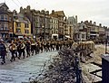 American troops marching through the streets of a British port town on their way to the docks where they will be loaded into landing craft for the big assault. Undated - June 1944.