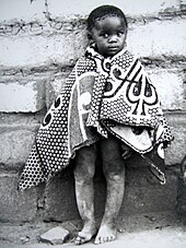 Child wrapped in a traditional Basotho blanket Retsilisitsoe Nthunya.jpg