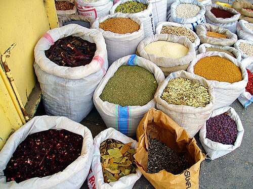 Spices, dried herbs, dried peppers, seeds, and legumes at a vendor's stall in Acre’s Old City Market in Israel.