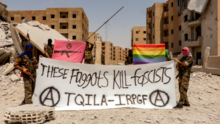 "These Faggots Kill Fascists! The Queer Insurrection and Liberation Army (TQILA), a subgroup of the IRPGF, in Raqqa." TQILA-IRPGF Raqqa.png