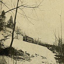 An Amherst & Sunderland car passes through The Notch of the Holyoke Range, 1903 Through Turkey Pass (The Notch), Amherst, Massachusetts.jpg